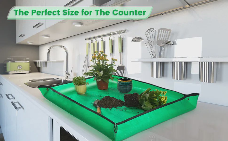 Onlysuki large repotting mat on kitchen counter with plants, soil and gardening tools, perfect size for countertop use